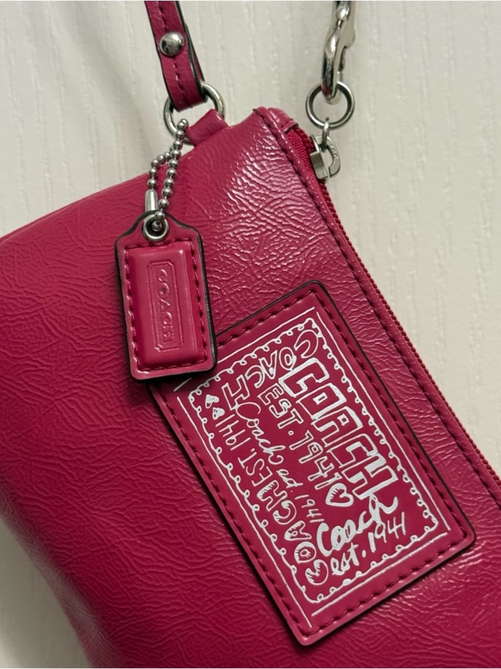 Coach Est. 1941 Poppy Leather Wristlet in “Berry” or “Hot Pink”